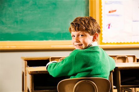 facing away - Portrait of boy at desk in classroom Stock Photo - Premium Royalty-Free, Code: 673-02141868