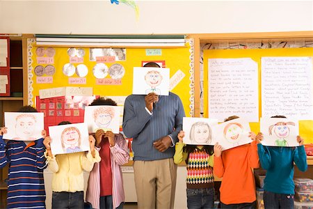Male teacher and students holding drawings over faces Stock Photo - Premium Royalty-Free, Code: 673-02141906