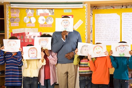 Male teacher and students holding drawings over faces Stock Photo - Premium Royalty-Free, Code: 673-02141907