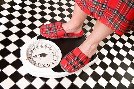 feet scale woman - Close up of person standing on bathroom scale Stock Photo - Premium Royalty-Free, Code: 673-02142141