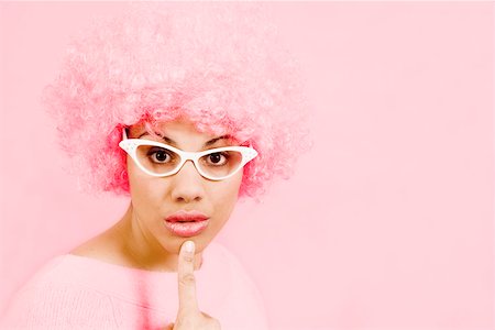 surprised black people - Woman wearing pink wig and eyeglasses Stock Photo - Premium Royalty-Free, Code: 673-02142197