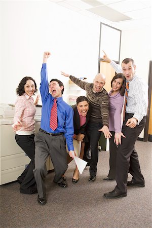 executive office profile - co-workers cheering next to photocopier machine Stock Photo - Premium Royalty-Free, Code: 673-02142293