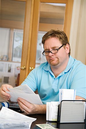 remunerating - Man reading mail Stock Photo - Premium Royalty-Free, Code: 673-02142417