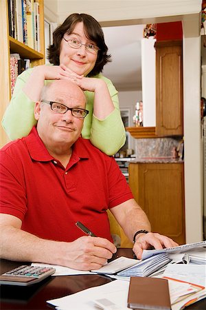 fat lady sitting - Couple paying bills Stock Photo - Premium Royalty-Free, Code: 673-02142495