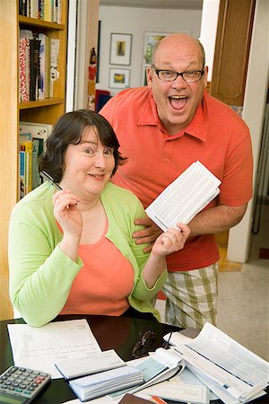 fat lady sitting - Couple paying bills Stock Photo - Premium Royalty-Free, Code: 673-02142519