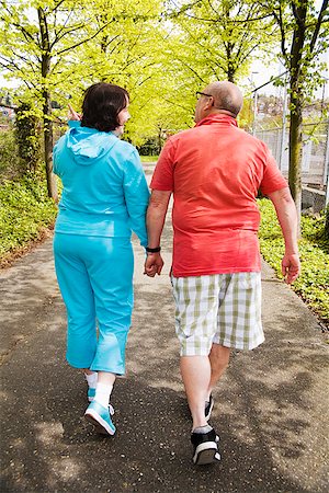 fat man exercising - Couple walking together outside Stock Photo - Premium Royalty-Free, Code: 673-02142553