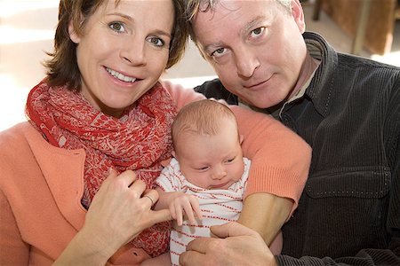 simsearch:673-02143625,k - Couple holding newborn infant Stock Photo - Premium Royalty-Free, Code: 673-02142657