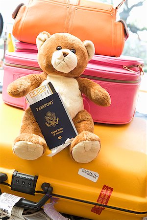 Teddy bear holding passport Stock Photo - Premium Royalty-Free, Code: 673-02142772