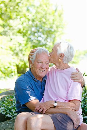 Senior woman kissing husband on head Stock Photo - Premium Royalty-Free, Code: 673-02142889