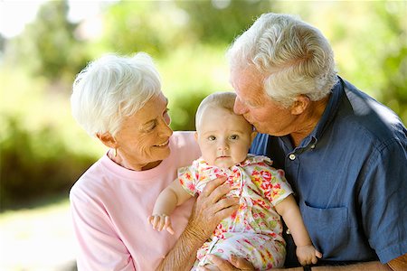 Senior couple holding baby Stock Photo - Premium Royalty-Free, Code: 673-02142892