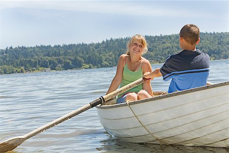 facing away - Boy and girl in row boat Stock Photo - Premium Royalty-Free, Code: 673-02142952