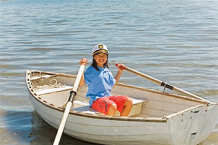 Young Asian girl in row boat Stock Photo - Premium Royalty-Free, Code: 673-02142965