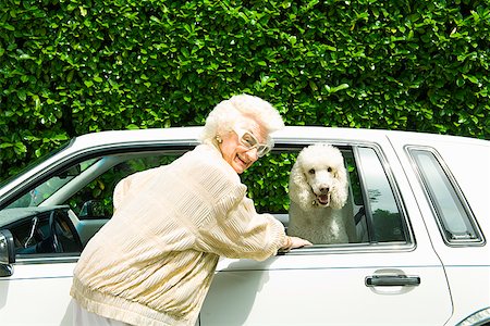 Senior woman next to dog in car Stock Photo - Premium Royalty-Free, Code: 673-02143201