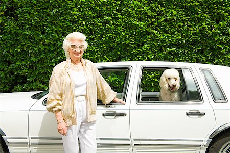 Senior woman next to dog in car Stock Photo - Premium Royalty-Free, Code: 673-02143202