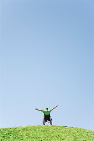 facing away - Person in wheelchair on top of hill Stock Photo - Premium Royalty-Free, Code: 673-02143287