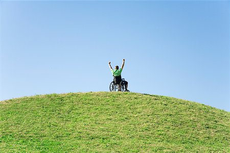 facing away - Person in wheelchair on top of hill Stock Photo - Premium Royalty-Free, Code: 673-02143283