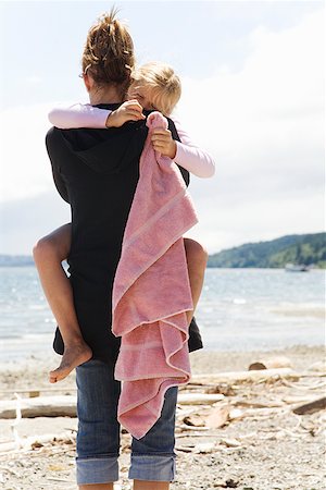 simsearch:673-02143625,k - Mother hugging daughter at beach Stock Photo - Premium Royalty-Free, Code: 673-02143300