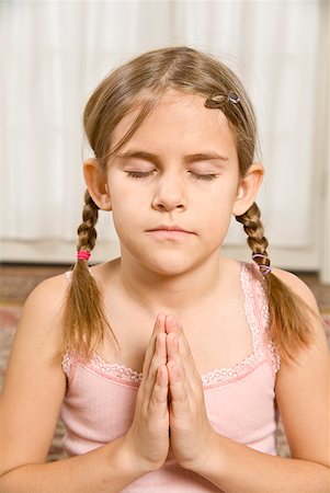 preteen girls flexible - Girl praying with eyes closed Stock Photo - Premium Royalty-Free, Code: 673-02143542