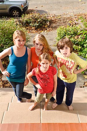 Group of siblings making faces Stock Photo - Premium Royalty-Free, Code: 673-02143595