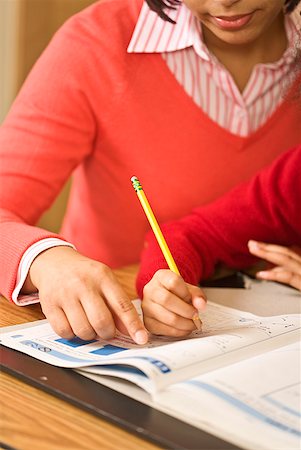 simsearch:400-05749563,k - African mother helping daughter with homework Stock Photo - Premium Royalty-Free, Code: 673-02143680