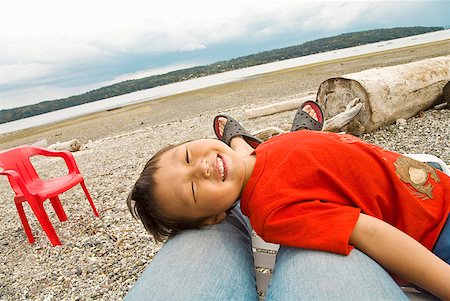 simsearch:673-02143625,k - Asian boy lying on mother’s legs Stock Photo - Premium Royalty-Free, Code: 673-02143937