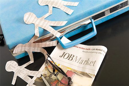 Paper dolls, briefcase and employment section of newspaper Stock Photo - Premium Royalty-Free, Code: 673-02216503