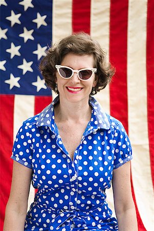simsearch:673-02143767,k - Patriotic woman posing with American flag Stock Photo - Premium Royalty-Free, Code: 673-02216544