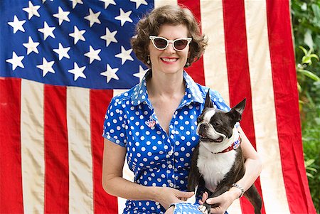 simsearch:673-02143767,k - Patriotic woman and Boston Terrier dog posing with American flag Stock Photo - Premium Royalty-Free, Code: 673-02216547