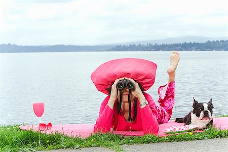 simsearch:673-02386607,k - Woman in pink and dog relaxing by bay Stock Photo - Premium Royalty-Free, Code: 673-02216543