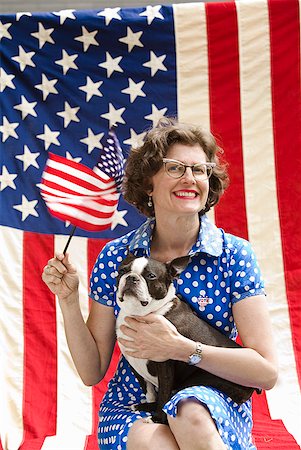 simsearch:673-02143767,k - Patriotic woman and Boston Terrier dog posing with American flag Stock Photo - Premium Royalty-Free, Code: 673-02216554