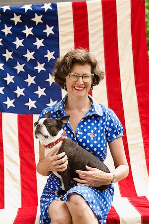 simsearch:673-02143767,k - Patriotic woman and Boston Terrier dog posing with American flag Stock Photo - Premium Royalty-Free, Code: 673-02216552