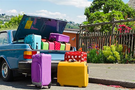 funny luggage - Car trunk loaded with colorful suitcases Stock Photo - Premium Royalty-Free, Code: 673-02216562
