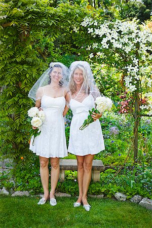 Two brides in garden Stock Photo - Premium Royalty-Free, Code: 673-03005504