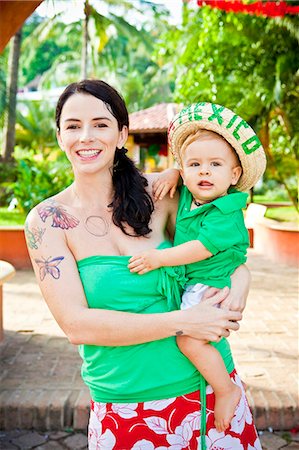 simsearch:673-03405645,k - tattoed mom with baby Stock Photo - Premium Royalty-Free, Code: 673-03405711