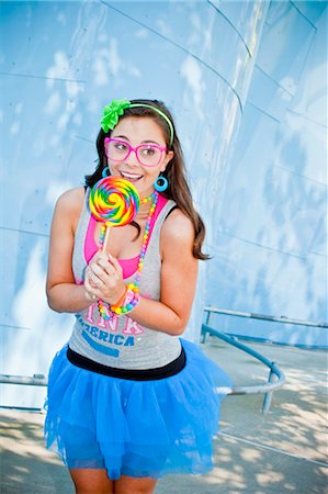 picture of a red lollipop - teen girl with large lollipop Stock Photo - Premium Royalty-Free, Code: 673-03826330