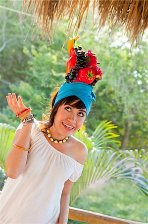 young woman wearing fruit hat Stock Photo - Premium Royalty-Free, Code: 673-03826458