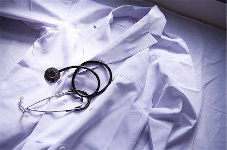 Lab coat and stethoscope Stock Photo - Premium Royalty-Free, Code: 685-02938421