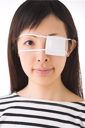 eye patch - A woman wearing eye patch Stock Photo - Premium Royalty-Free, Code: 685-02938566