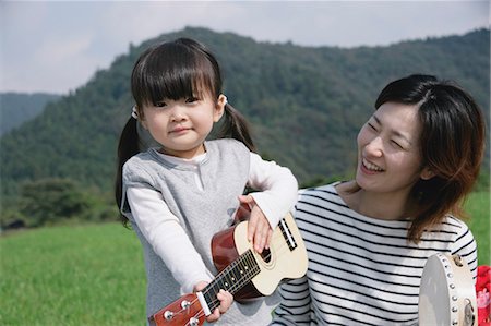 Mother and daughter with musical instruments Stock Photo - Premium Royalty-Free, Code: 685-02939103