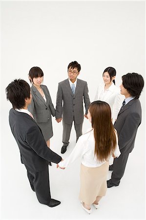 six people holding hands - Business people standing in circle holding hands Stock Photo - Premium Royalty-Free, Code: 685-02939332