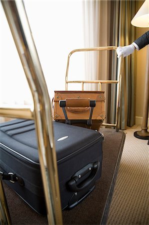 Suitcases on luggage cart Stock Photo - Premium Royalty-Free, Code: 685-02941648