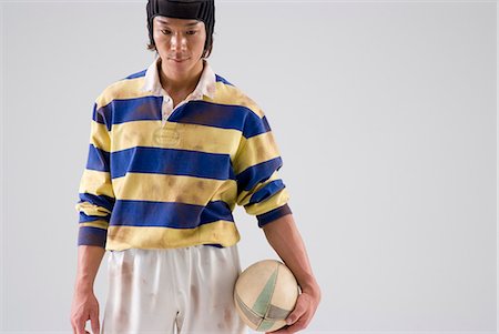 sports jersey - Rugby player holding ball Stock Photo - Premium Royalty-Free, Code: 685-02941750