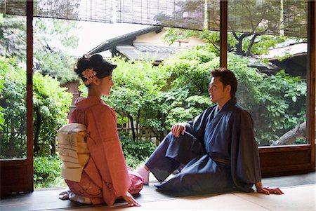 Young couple in kimono sitting at veranda Stock Photo - Premium Royalty-Free, Code: 685-03082598