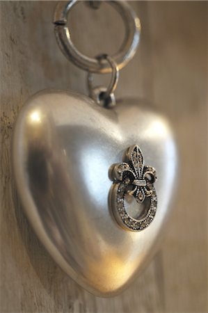simsearch:695-03386286,k - Necklace with heart-shaped pendant Stock Photo - Premium Royalty-Free, Code: 689-05610558