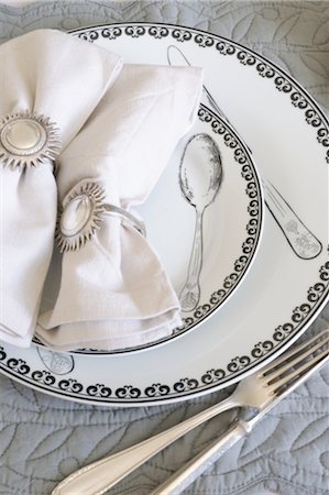 dinnerware - Ornate plates, cutlery and napkins Stock Photo - Premium Royalty-Free, Code: 689-05611530