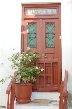 flowers greece - Flower tub in front of house entrance Stock Photo - Premium Royalty-Free, Code: 689-05611680