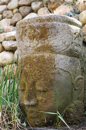 Buddha statue made of stone in garden Stock Photo - Premium Royalty-Free, Code: 689-05611843