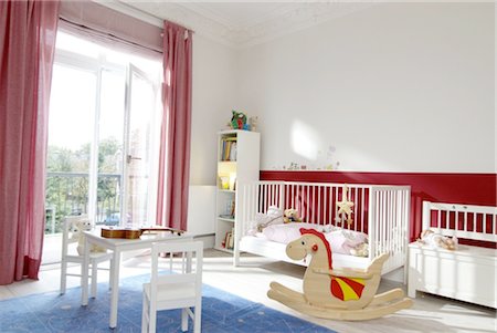 distinctive - Childrens room with rocking dragon and crib Stock Photo - Premium Royalty-Free, Code: 689-05612312