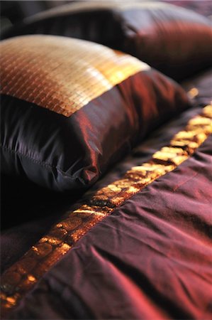 pictures of red colour objects - Elegant cushions on blanket Stock Photo - Premium Royalty-Free, Code: 689-05612460