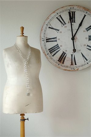 fashion and accessory - Old wall clock and tailors dummy with necklace Stock Photo - Premium Royalty-Free, Code: 689-05612503